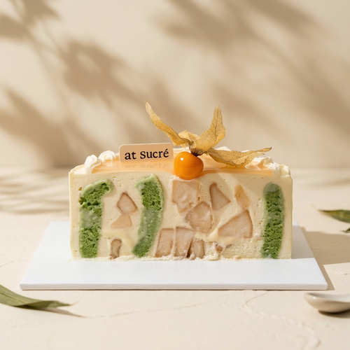 Cross-section of Pear and Pandan Glutinous Rice Cake by at sucré Singapore - layered fresh cream cake
